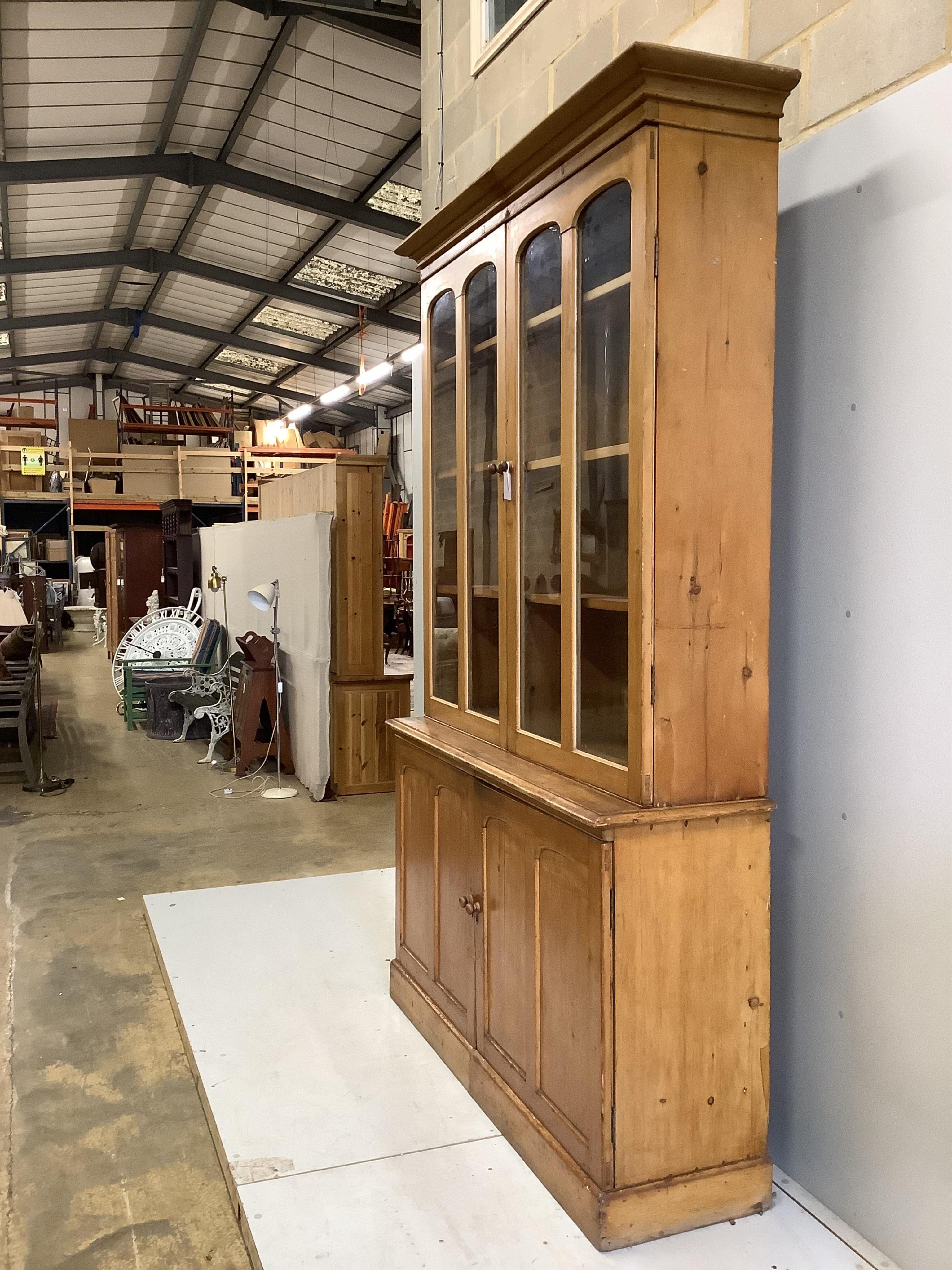 A Victorian pine library bookcase, width 154cm, depth 46cm, height 242cm. Condition - fair